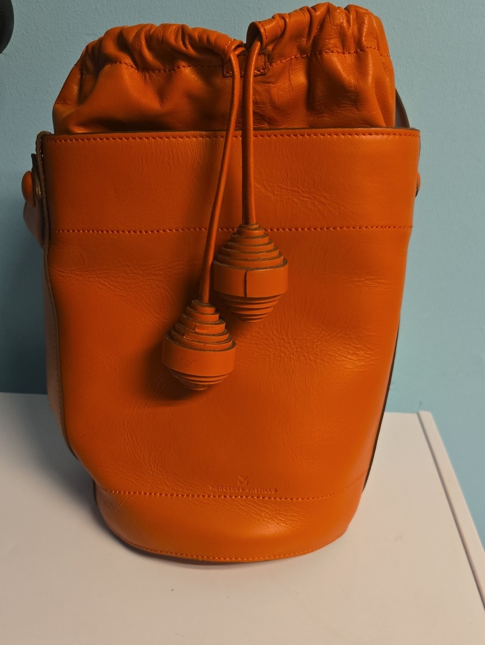 Mercedes Castillo Orange Leather Drawstring Bucket Bag -